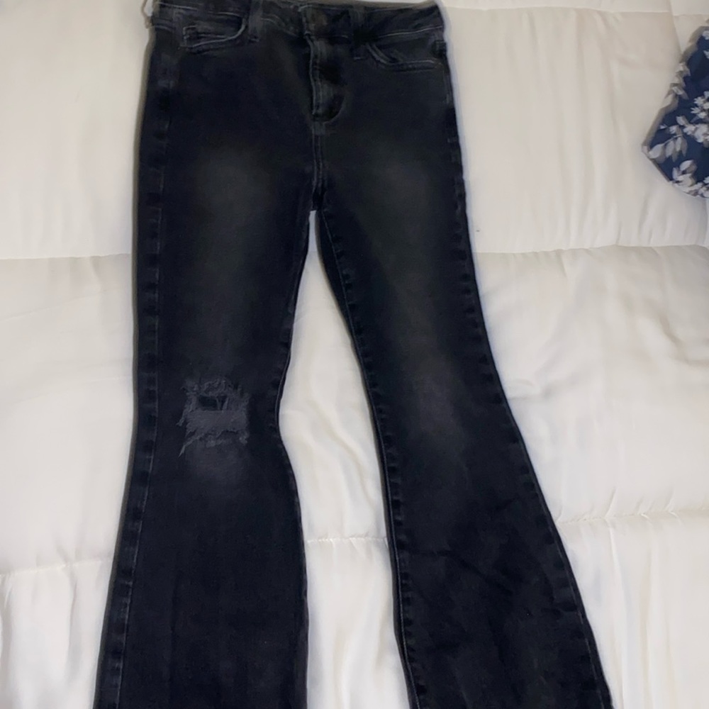 I am selling a pair of black jean style pants.